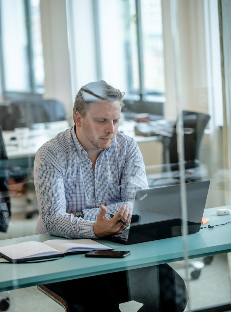 Man sitting at desk at a laptop